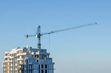 Fototapeta premium Construction site, tower crane on sky background