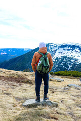 Silhouette of a man on a background of mountains.