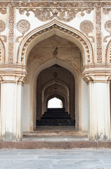Fototapeta na wymiar Entrance to a tomb building in Qutb Shahi Archaeological Park, Hyderabad, India