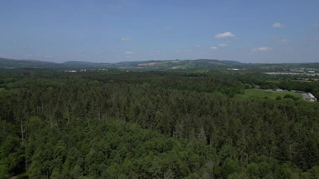 Stover Country Park, South Devon, England: DRONE AERIAL VIEWS: Heavily forested area of the park with clay quarries in the distance.