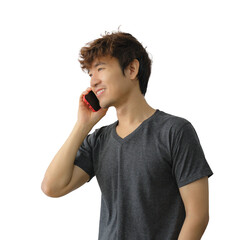 Portrait of Asian man in black t-shirt talking on mobile phone showing happy mood and soft sunlight shining on him.	
