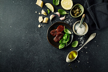 Mediterranean food ingredients on dark stone background. Copy space. Flat lay - 606071258