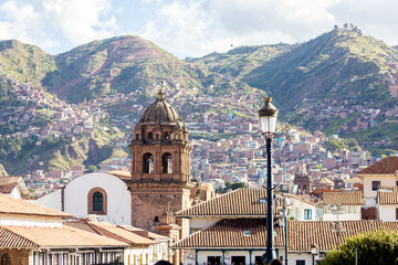 Fototapeta na wymiar Cusco skyline, with Santo Domingo church, historical buildings and Andes in the background, Peru, South American