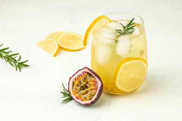 fresh and iced passion fruit juice on a light background, refreshing drink or beverage with ice, place for text