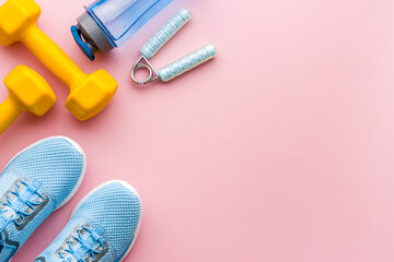 Athletics set with sneakers and dumbbells, top view