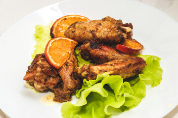 Baked chicken wings with honey and orange.