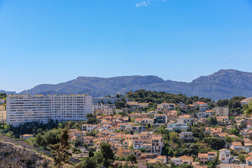 A scenics aerial view of the city of Marseille, bouches-du-rh&ocirc;ne, France under a majestic blue sky and some white clouds
