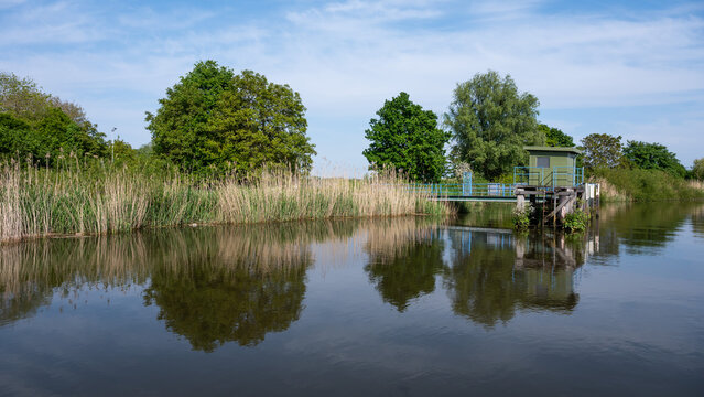 Scenic view over nature reflections in the water of the River Durme, Tielrode, Belgium