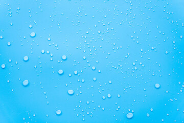 Naklejka na ściany i meble Water or rain drops on blue background 