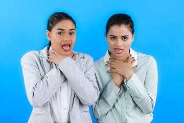 Awkward Choked Face Expressions Shown by Two Indian Office Friends and Colleagues