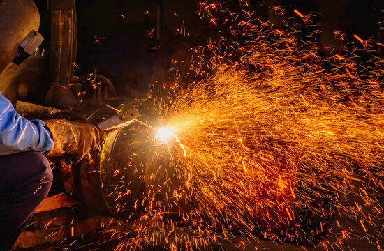 Gouging welding steel structure and bright sparks in steel construction industry.