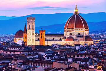 Fototapeta na wymiar The view of the Cattedrale di Santa Maria del Fiore from Piazza Michelangelo in Florence at sunset.
