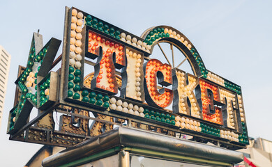 Ticket booth sign illuminated at twilight