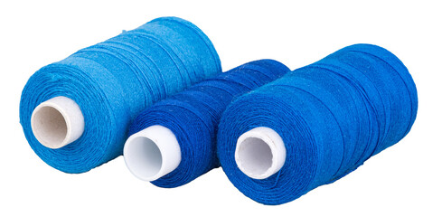 Spools with blue thread for sewing, supply for sewing, isolated objects 
