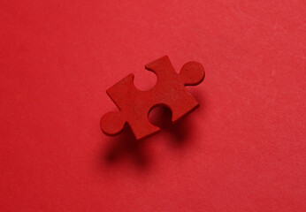 Red jigsaw puzzle particle on red background. Business concept