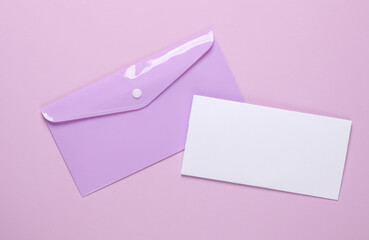 Plastic envelope with a letter on a purple background