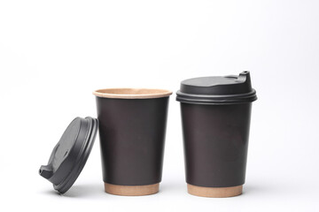 Take-out cardboard coffee cups with lid on white background