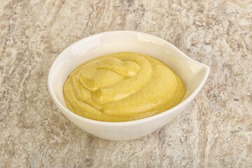 Organic mustard sauce in the bowl