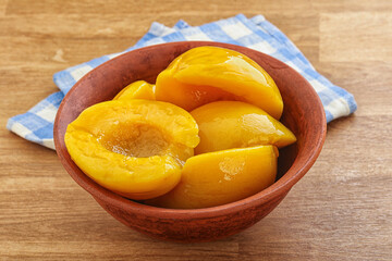 Sweet canned peaches with syrope