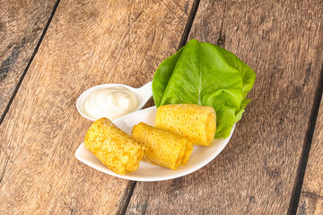 Stuffed pancakes with cream sauce