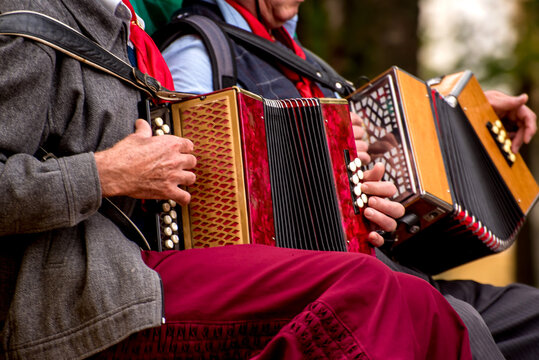 Duo of gaiteros, gauchos playing harmonica