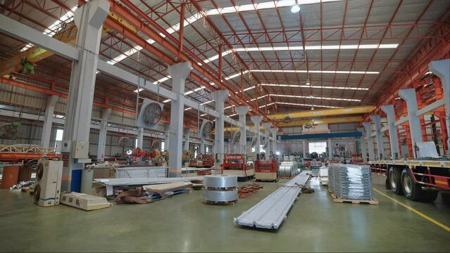 Large industrial buildings or factories with steel structures. Large industrial hall. Warehouse for storage and distribution products of metal sheet roof plant