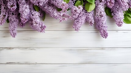 romantic floral composition with loosely arranged lilac flowers on a rustic white wooden background, spring, gardening or Mother's Day concept, top view, flat lay