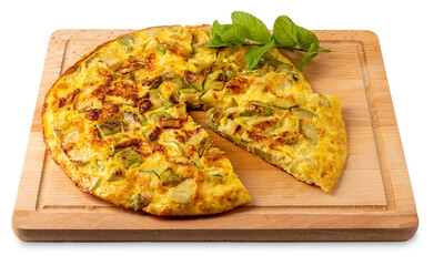 Omelet with zucchini with leaves and of mint, whole omelet with cut slice on wooden cutting board isolated on white with clipping path included