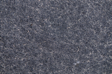 Granite surface as background. Grunge stone texture. Basalt. Rock surface background