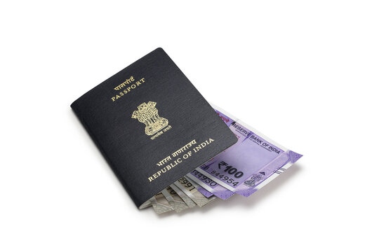 Indian passport and indian currency notes together.