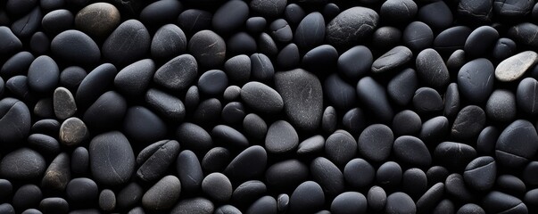 a birds-eye view of Black river stones in a  horizontal format for a product backdrop, Abtract-themed,  photorealistic illustrations in JPG. Generative AI
