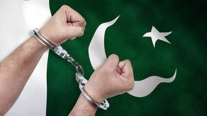 A man getting under arrest in Pakistan. Concept of being handcuffed, detained, incarcerated and...