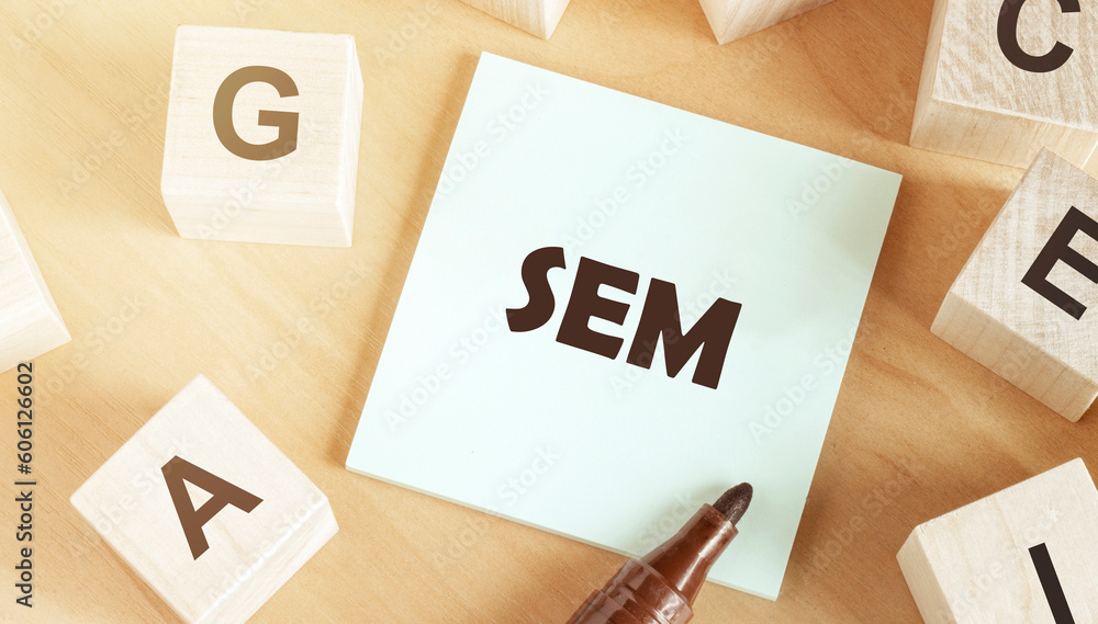 Poster sticker with text sem in the middle of wooden cubes with letters