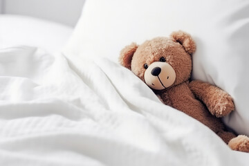 Cute little teddy bear lying sleeping alone on white bed in morning, generative ai.