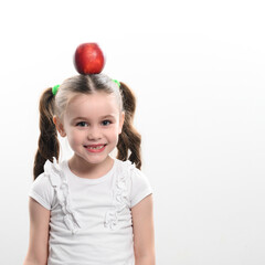 Red apple and little girl, portrait of a child on a white background