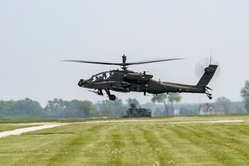 Fototapeta na wymiar AH-64 Apache in flight during an airshow