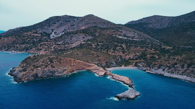 Aerial view of Aegean rocky reef coast shore from above
