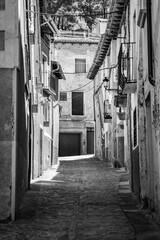 Fototapeta na wymiar Narrow alley with old stone houses in the medieval town of Daroca, Zaragoza, Spain.
