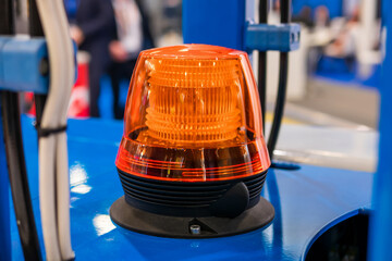 Close up of alarm lamp signal warning flashing lights for industrial machinery at emergency, support and services exhibition. Danger, legal, alert light, attention, hazard, manufacturing concept