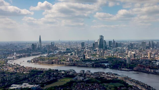Time lapse view of the London skyline along the river Thames from London Bridge until the City during a sunny day, United Kingdom 