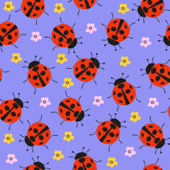 Ladybug with flowers seamless pattern. Vector illustration on a blue background.