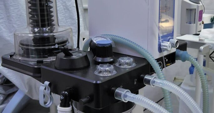 Artificial lung ventilation apparatus works in surgery veterinary clinic. Gas anesthesia machine in the process of working in a veterinary operating room. Anesthesia equipment concept.
