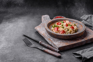 Delicious boiled rice with peppers, peas, asparagus beans and carrots