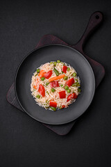 Delicious boiled rice with peppers, peas, asparagus beans and carrots