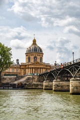Fototapeta na wymiar Mazarine Library from boat trip on the Seine, in Paris, France