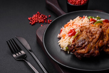 Delicious boiled rice with peppers, peas, asparagus beans and carrots and fried chicken