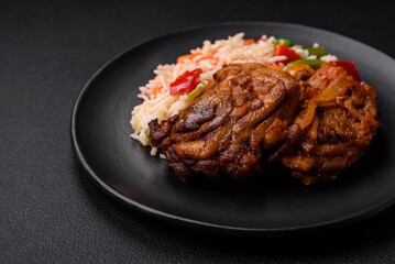 Delicious boiled rice with peppers, peas, asparagus beans and carrots and fried chicken