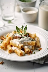 rigatoni with white cream sauce and caramelized onions on top, in an antique white plate. Generative AI