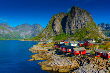 The little fishermen village with red houses of Hamnoy, in the Lofoten Islands,  Norway - obrazy, fototapety, plakaty