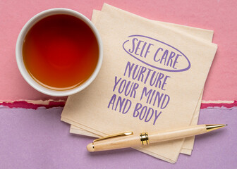 self care, nurture your mind and body - inspirational reminder on a napkin with tea, mental and physical health and lifestyle concept